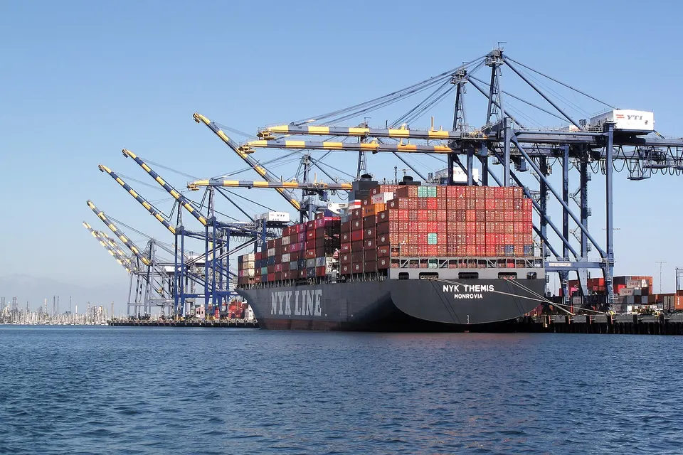 The container ship NYK Themis alongside quay cranes at the Port of Los Angeles